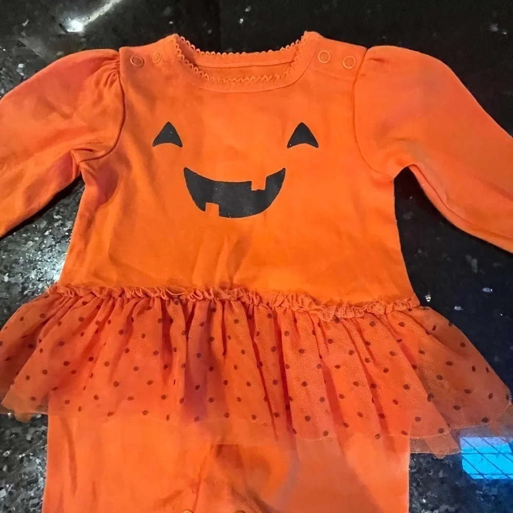 Cute baby girl Jack-o-Latern Halloween onsie with feet and skirt